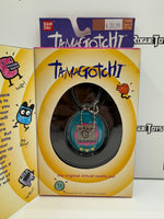 Bandai Tamagotchi (Blue and Pink Shell w/ Yellow Buttons)