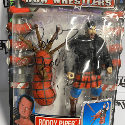 ToyBiz Power Slam WCW Wrestlers Roddy Piper with Missile Firing Bag Pipes and Hammer Punching Action Autographed - Rogue Toys